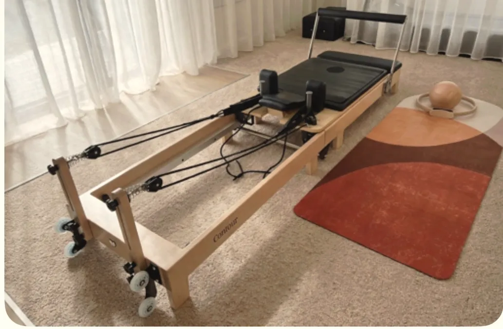 Reformer beside a terracotta floor mat